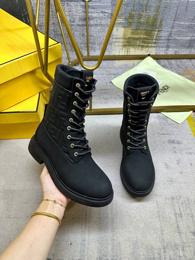 Fendi Filo round-toe lace-up military boots. Made of black waterproof suede with
