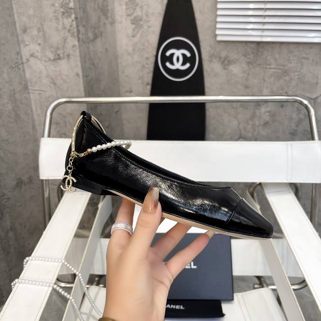 Chanel's hottest spring/summer Mary Jane ballet flats with chain pearl anklets,