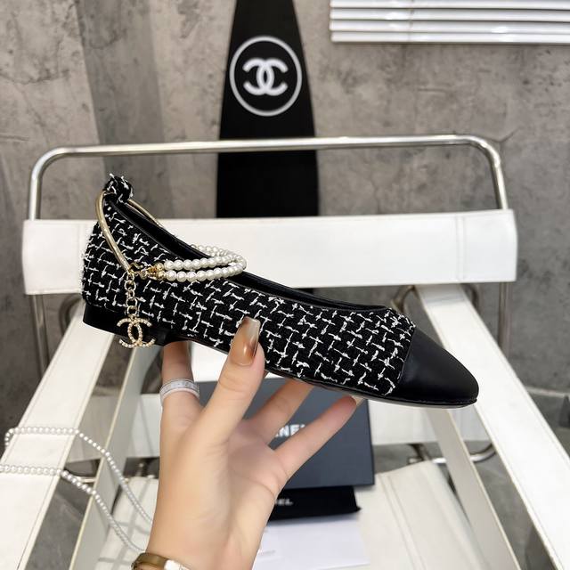 Chanel's hottest spring/summer Mary Jane ballet flats with chain pearl anklets,