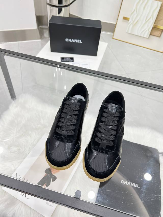 Chanel premium casual sneakers. This classic design features a multi-layered emb