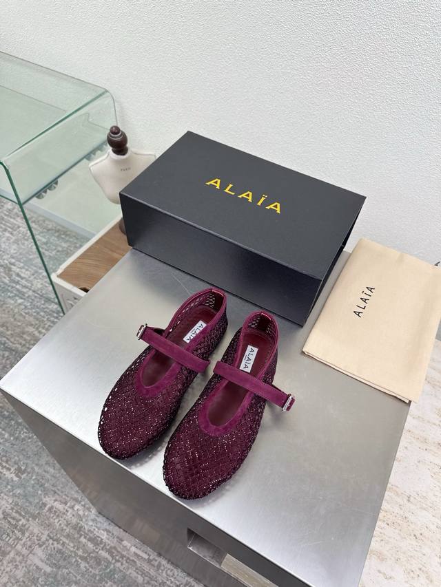 Exquisite diamond-encrusted Alaia slippers from Paris. A stunning burgundy colo