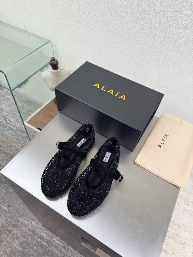 Exquisite diamond-encrusted Alaia slippers from Paris. A captivating black desi