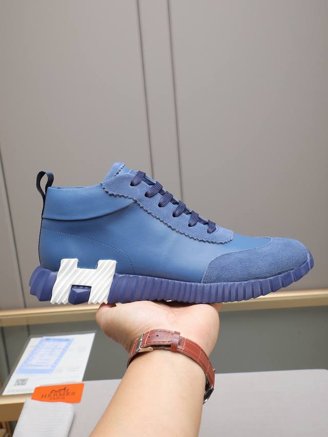 Hermes high-top men's sneakers, featuring textured calfskin details. The upper