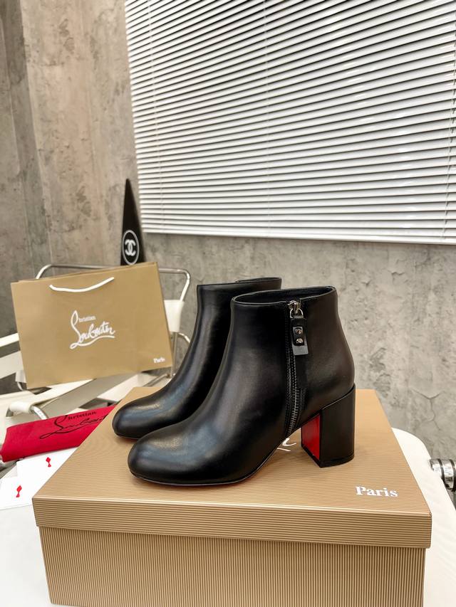 Christian Louboutin Cl's new chunky-heeled platform boots, crafted from glossy