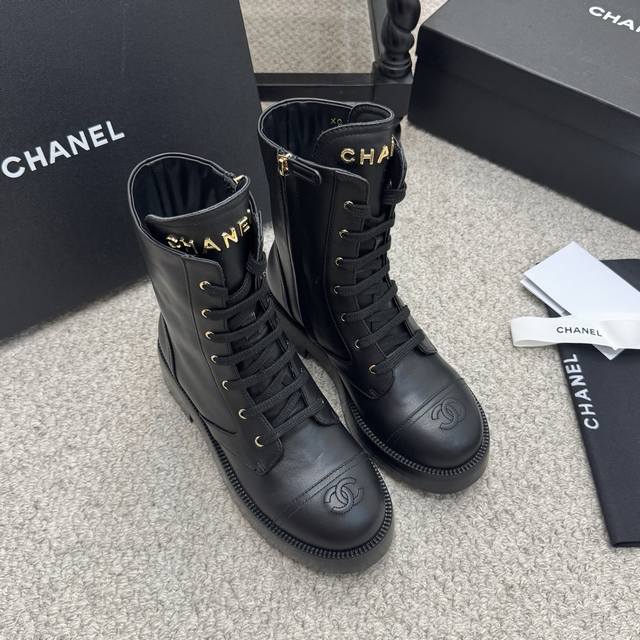 Classic Chanel 25K Double C Classic Rider Boots. The chain detail at the boot o