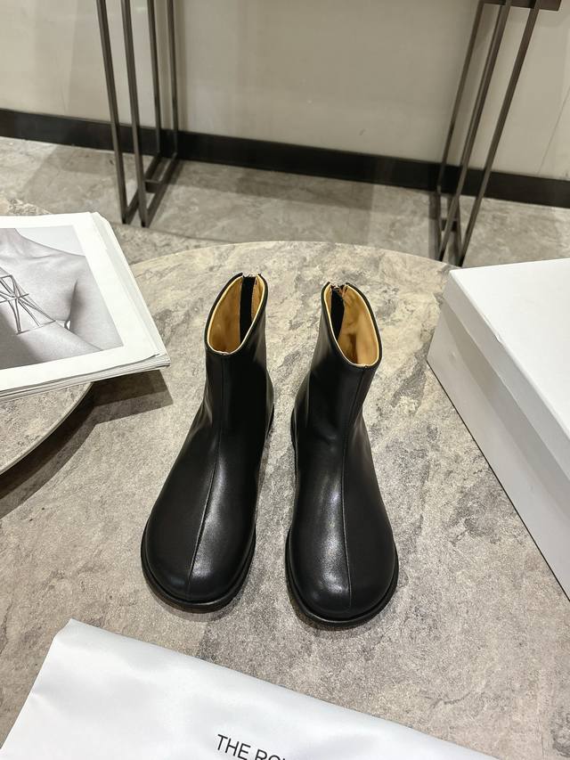The Row Canel Series Flat Round Toe Ankle Boots. The Canel series flat shoes are