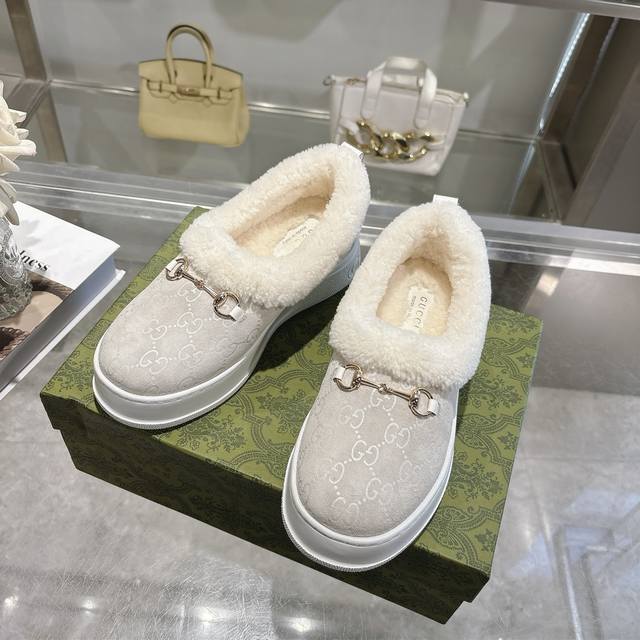 Paris Fashion Week Merino Sheepskin Flat-Top Snow Boots, featuring a suede uppe