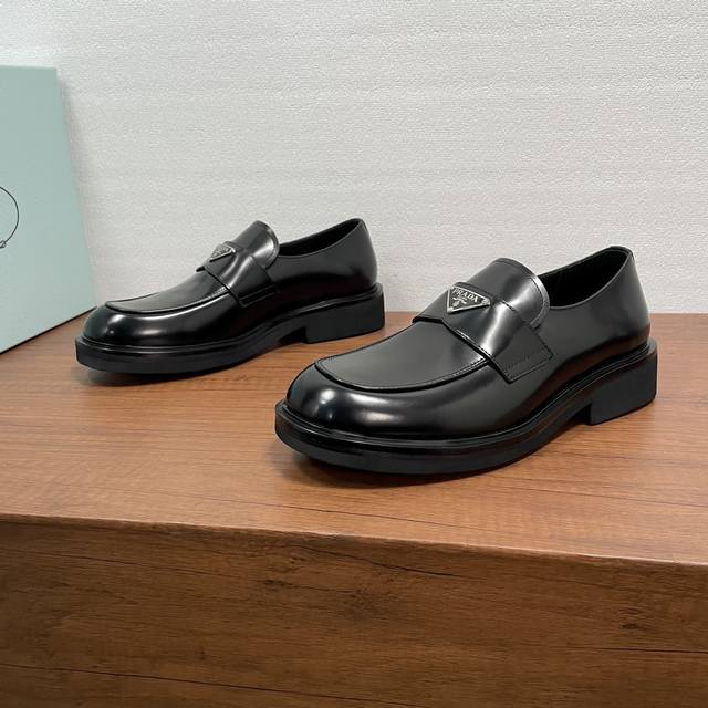 Prada Men's New Leather Loafers These loafers exude elegance and modern style.