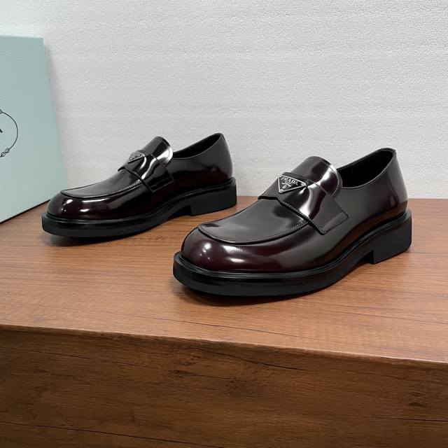Prada Men's New Leather Loafers These loafers exude elegance and modern style.