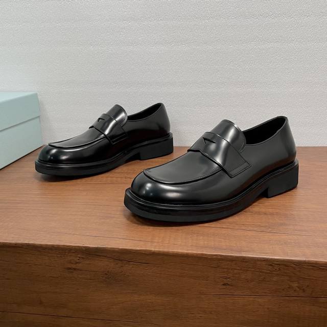 Prada Men's New Leather Loafers These loafers exude elegance and modern style.