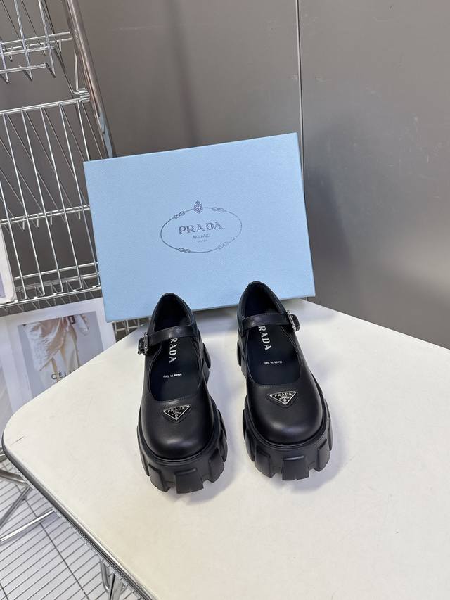 Prada's latest triangular logo platform Mary Jane loafers. Recommended by numer