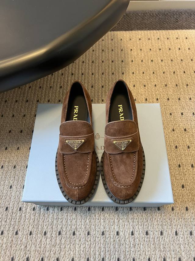 prad**Classic Loafers with Triangle Logo and Serrated Design These classic loafe
