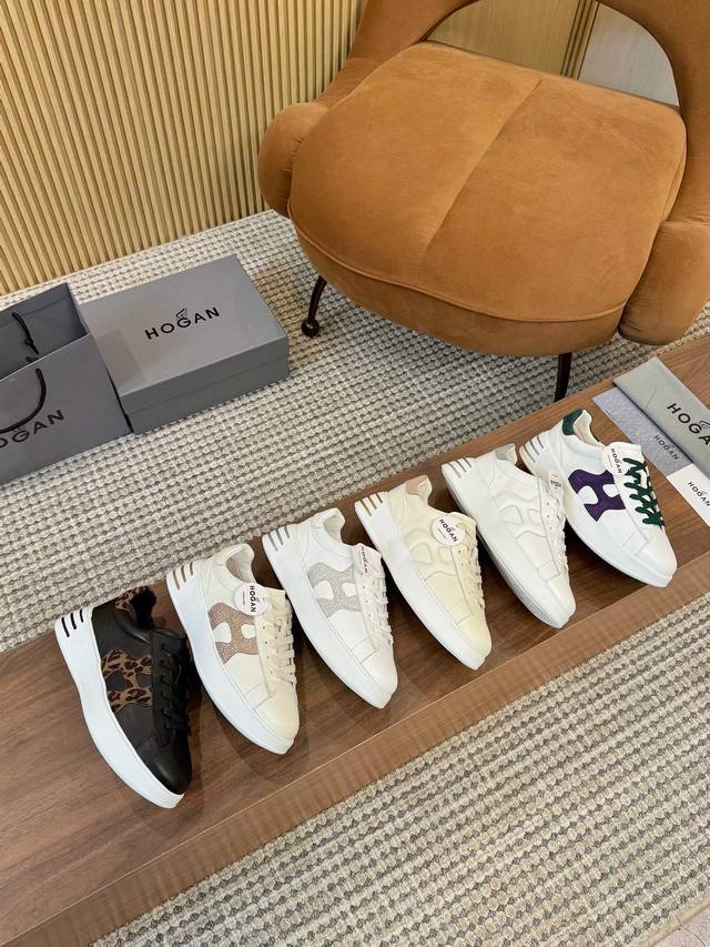 Hogan classic sneakers blend elegance and modernity. Rich color combinations and