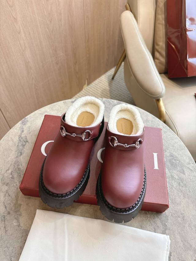 731-1A This burgundy leather mule pays homage to the brand's equestrian roots. T