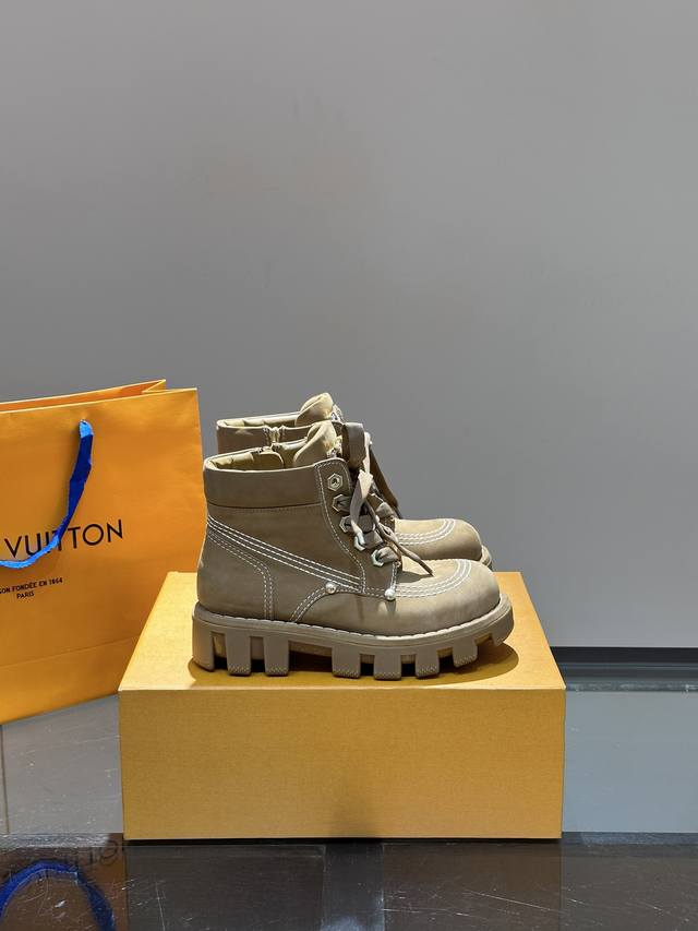 Ouis *Uitto* Checker Fall/Winter Couple Ankle Boots, showcased at the Louis Vuit