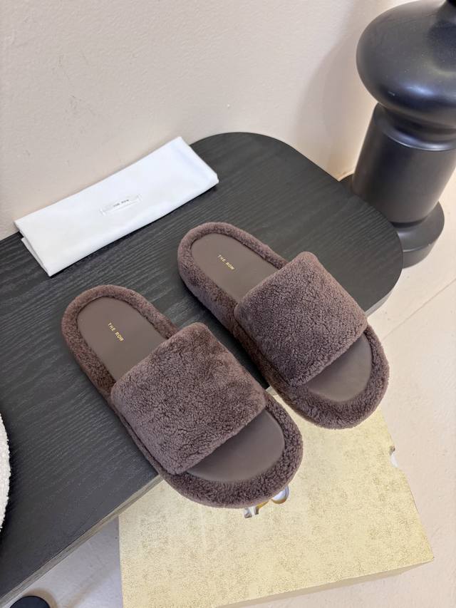 The Row's new fleece sandals. At first glance, these shoes seem unassuming, with