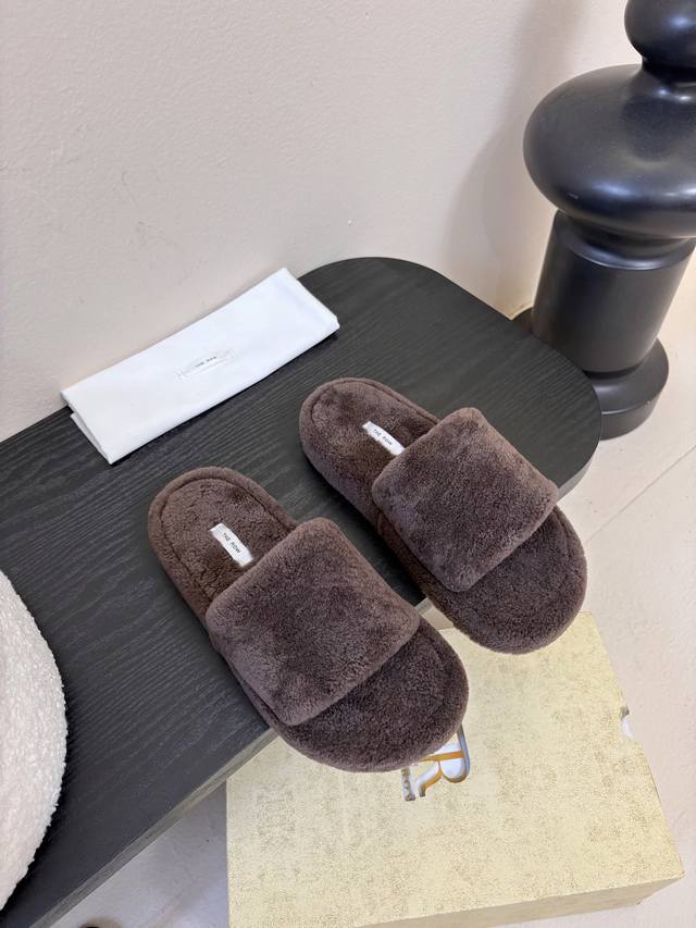 The Row's new fleece sandals. At first glance, these shoes seem unassuming, with