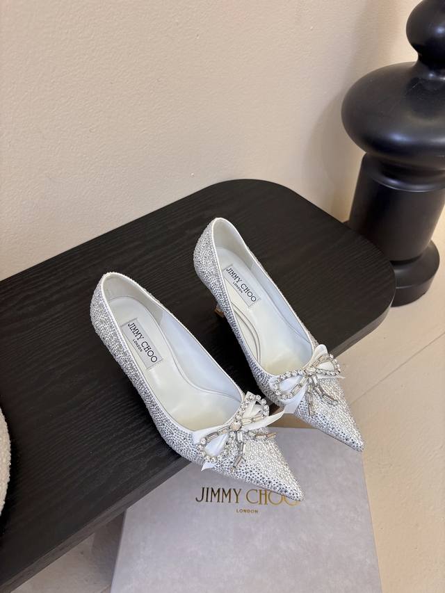 Jimmy Choo's rounded, lustrous design adorns your toes, enhancing your style and