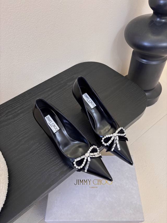 Jimmy Choo's rounded, lustrous design adorns your toes, enhancing your style and