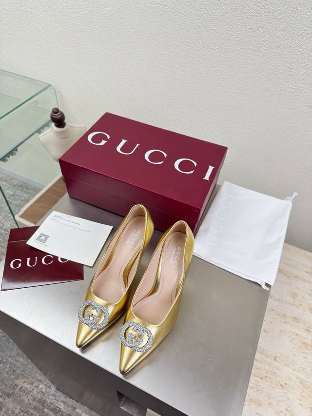 Classic Gucci Double G Rhinestone Buckle Shoes. Features a double G logo, gold